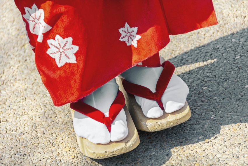 Japanese geisha wearing wooden clogs in Japan